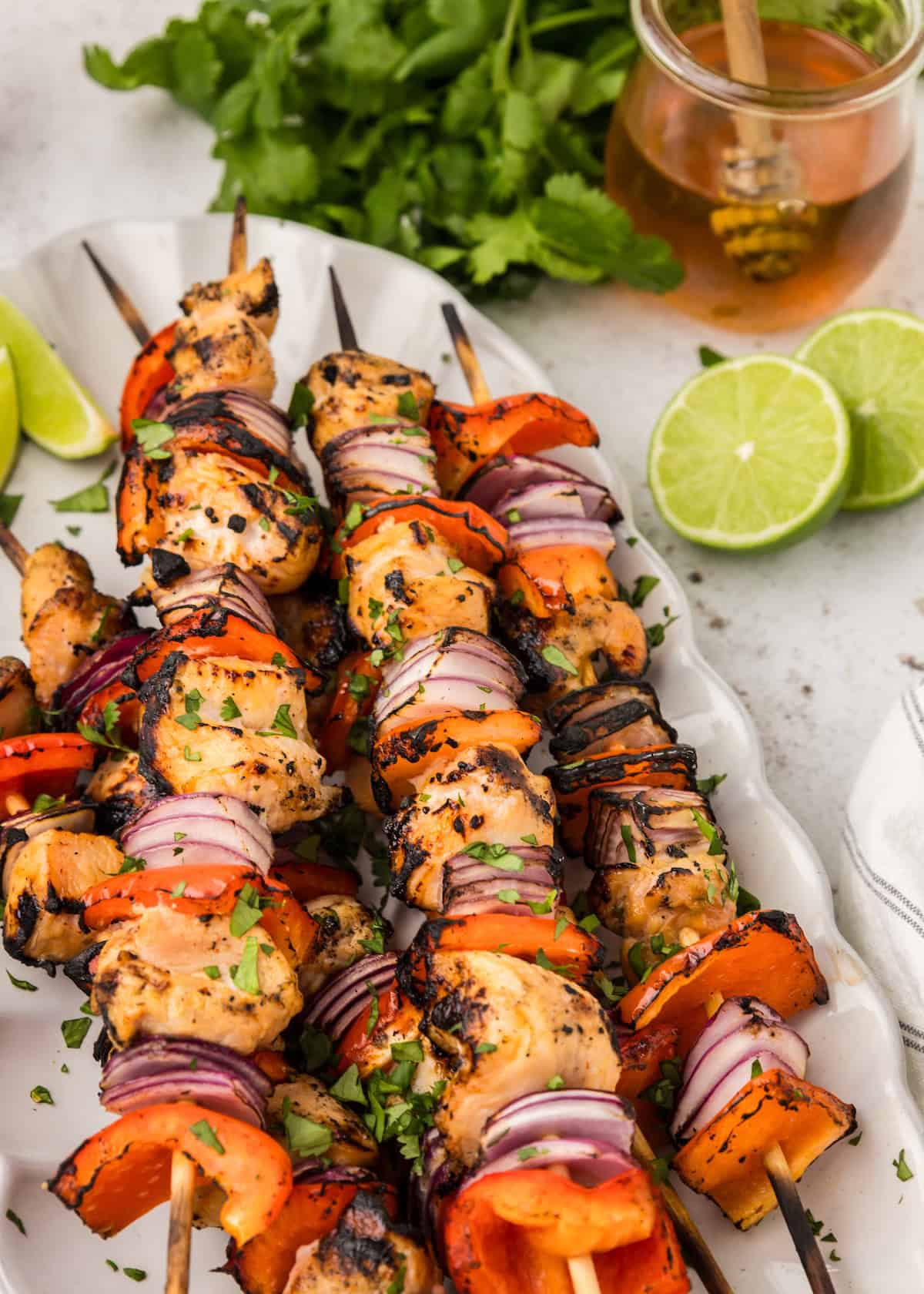 Honey Sriracha Chicken Skewers on serving platter.