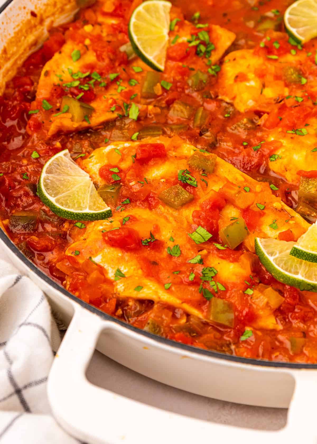 Chicken in tomato sauce with chopped herbs and lime, inspired by classic creole fish flavors.