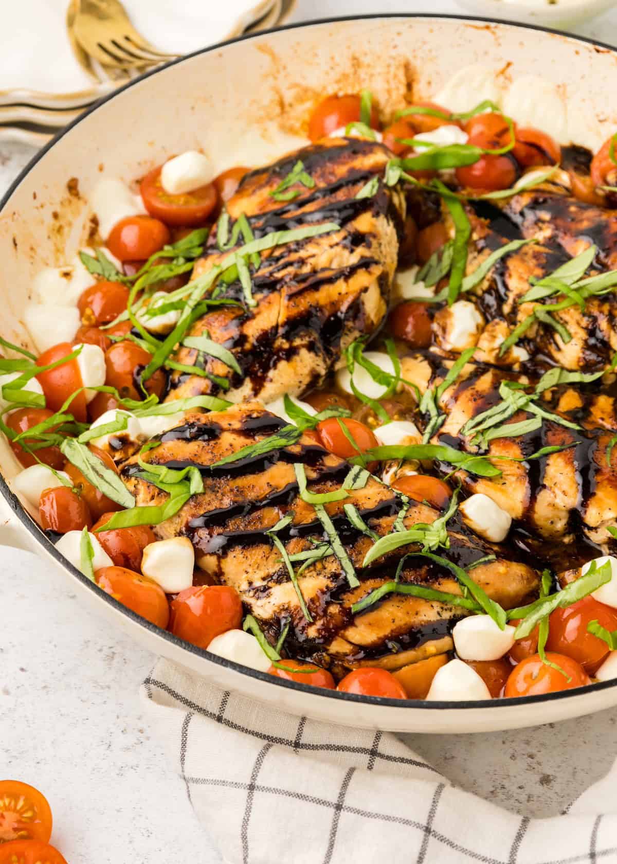 Caprese CHicken in pan with glaze.