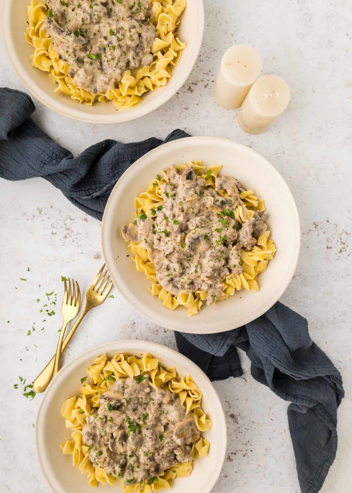 Ground Beef Stroganoff served in white bowls.