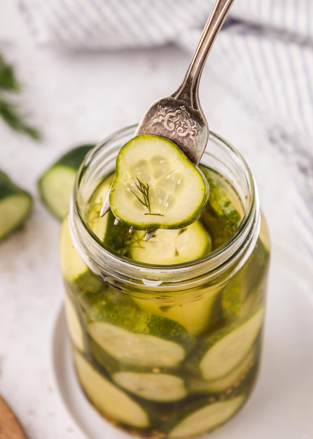 Homemade Pickles scooped out with a fork.