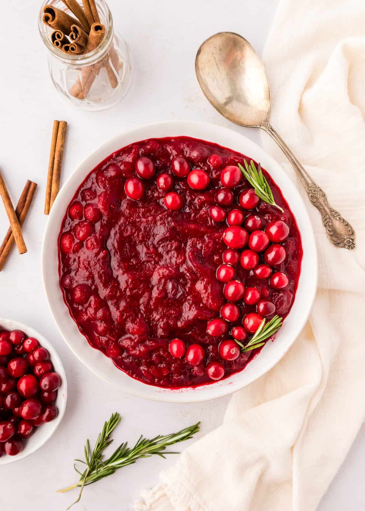 Homemade cranberry sauce in white bowl.