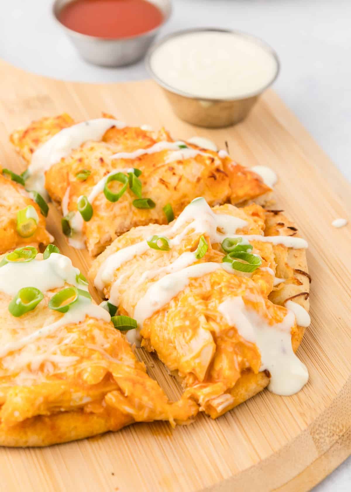 Buffalo chicken flatbread with blue cheese drizzle.