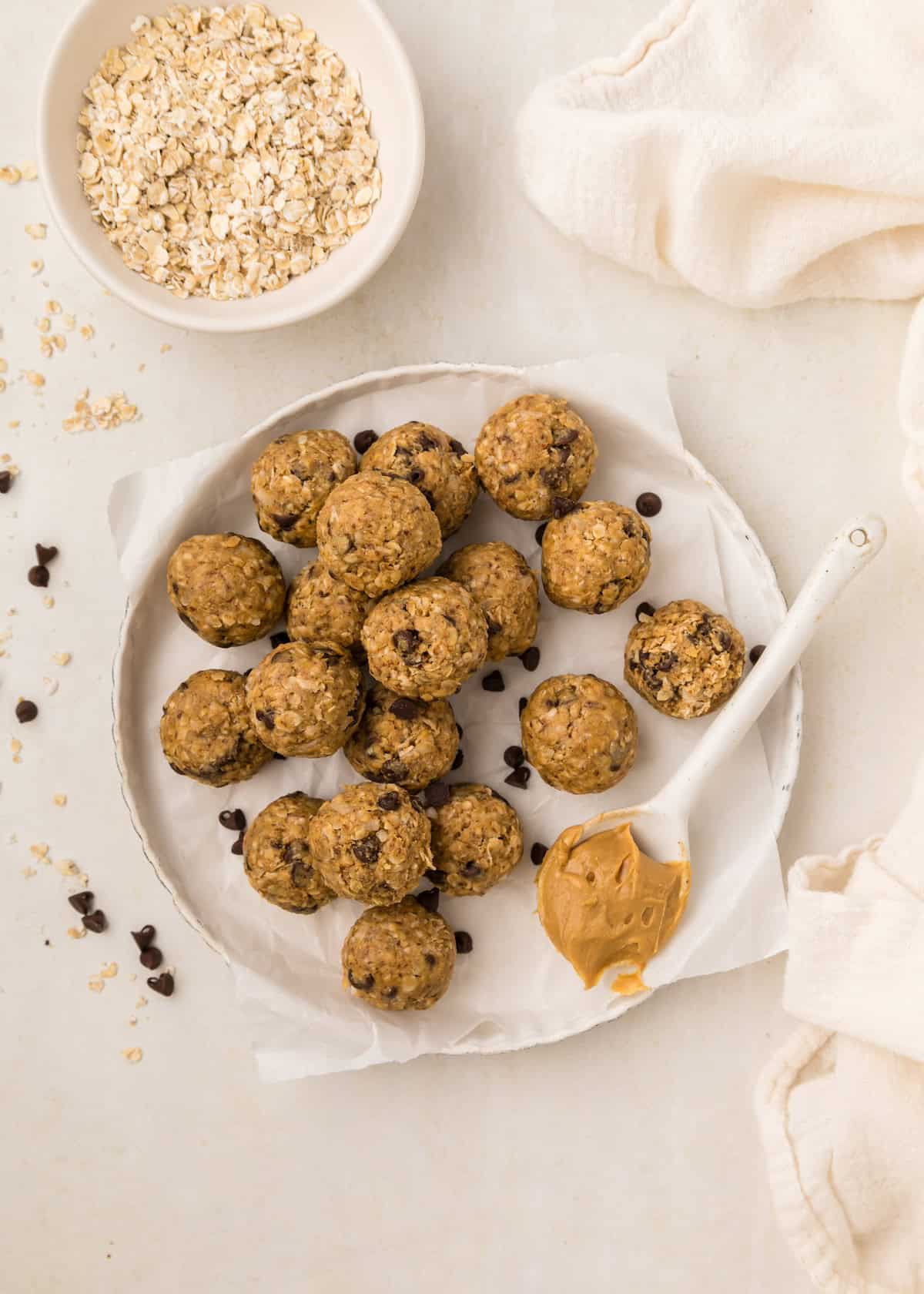 A plate of No Bake Protein Balls with chocolate chips, peanut butter, and oats.