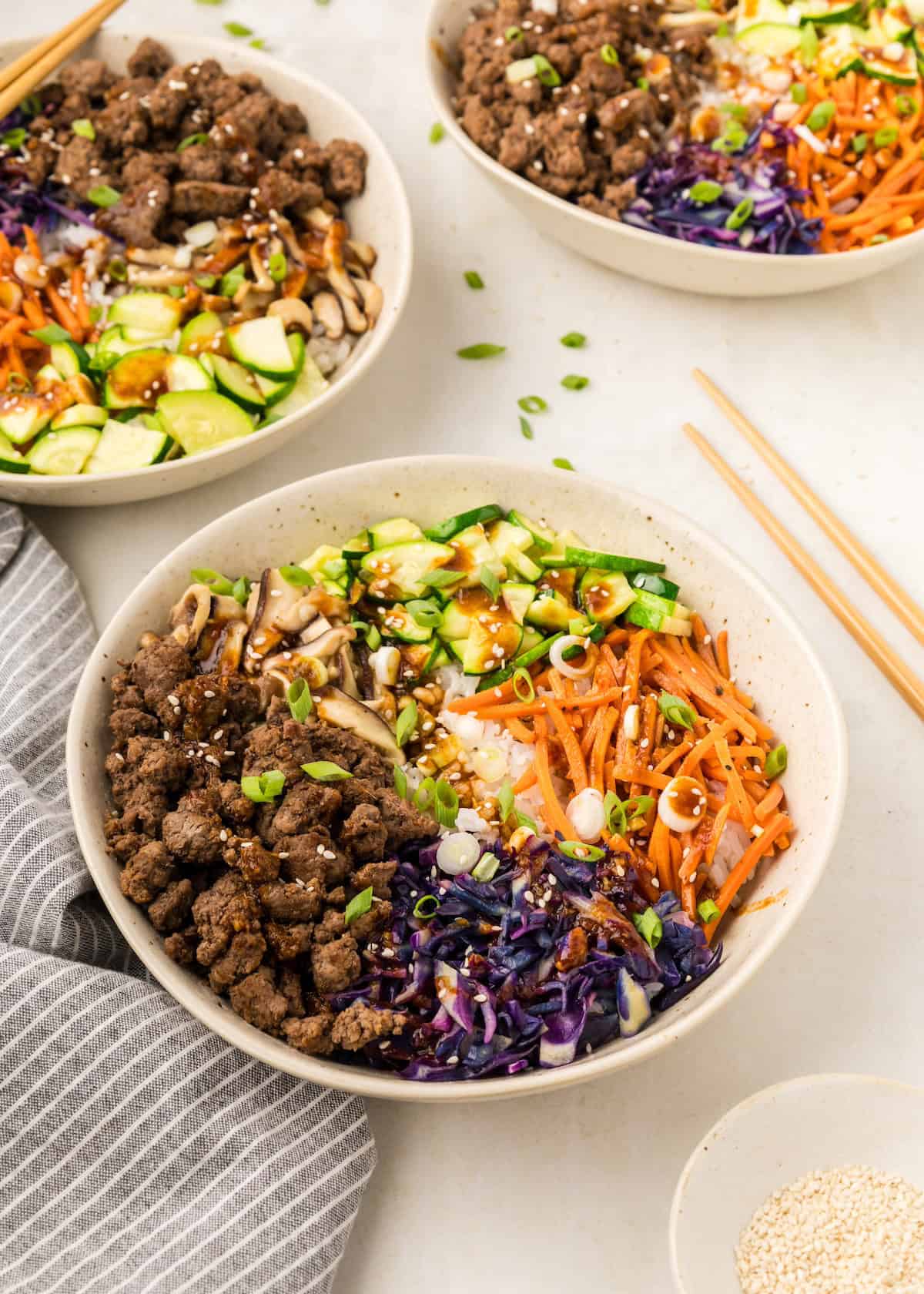 A bowl with ground beef, rice, veggies—perfect for easy Korean beef bowls at home.