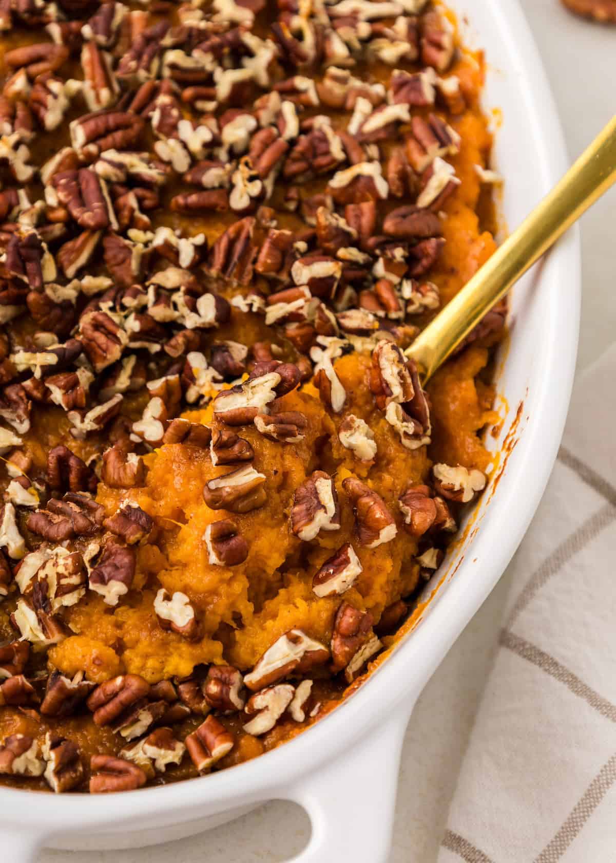 sweet potato casserole with serving spoon