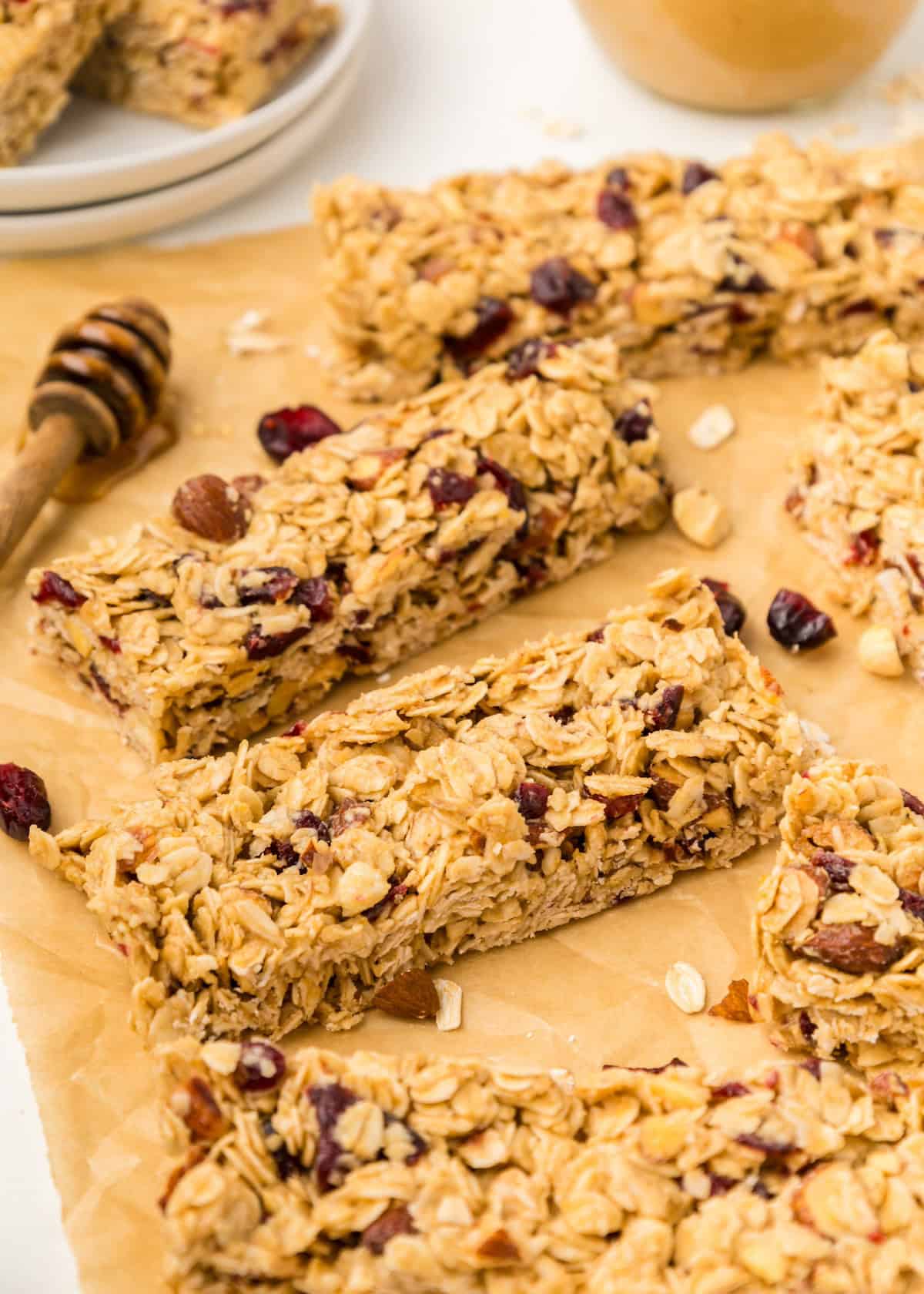 Breakfast Bars: Oatmeal granola bars with nuts and dried fruit on parchment paper.
