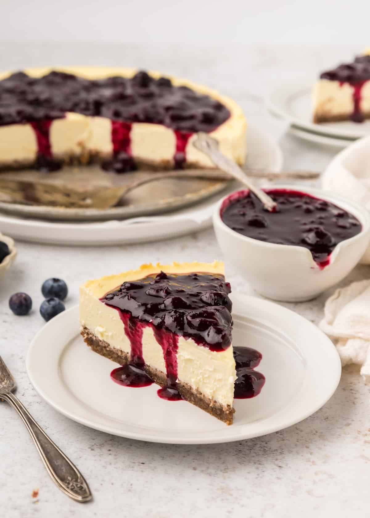 Healthy Cheesecake slice with blueberry compote.