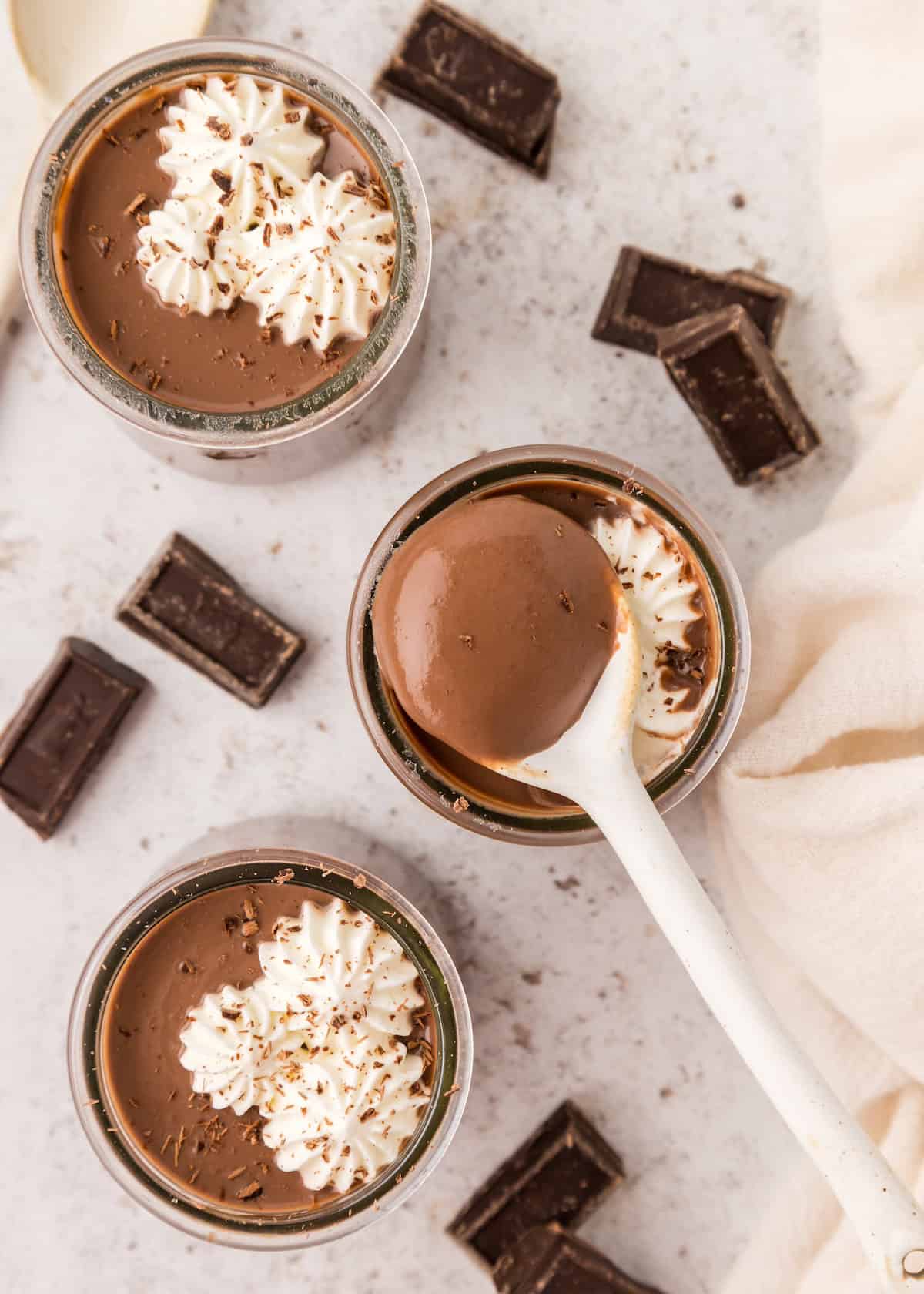 chocolate pudding in jars with spoon