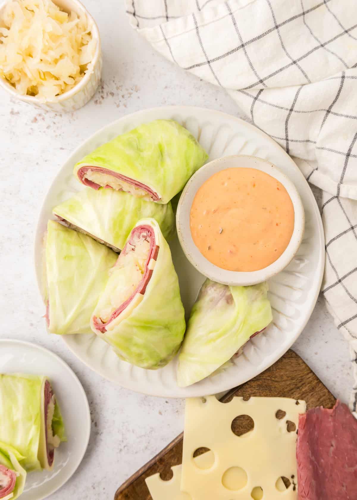 Reuben Wraps served with a side of thousand island dressing.