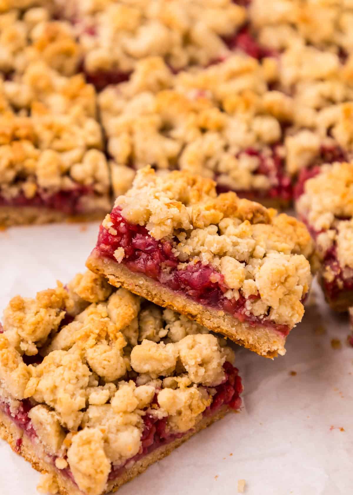 Raspberry Bars sliced and stacked.