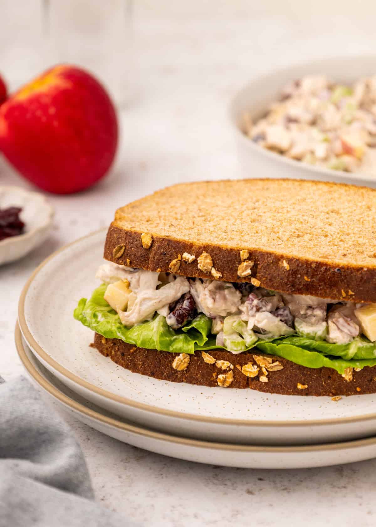 Leftover Turkey Salad on a sandwich, with a bowl of it in the background.