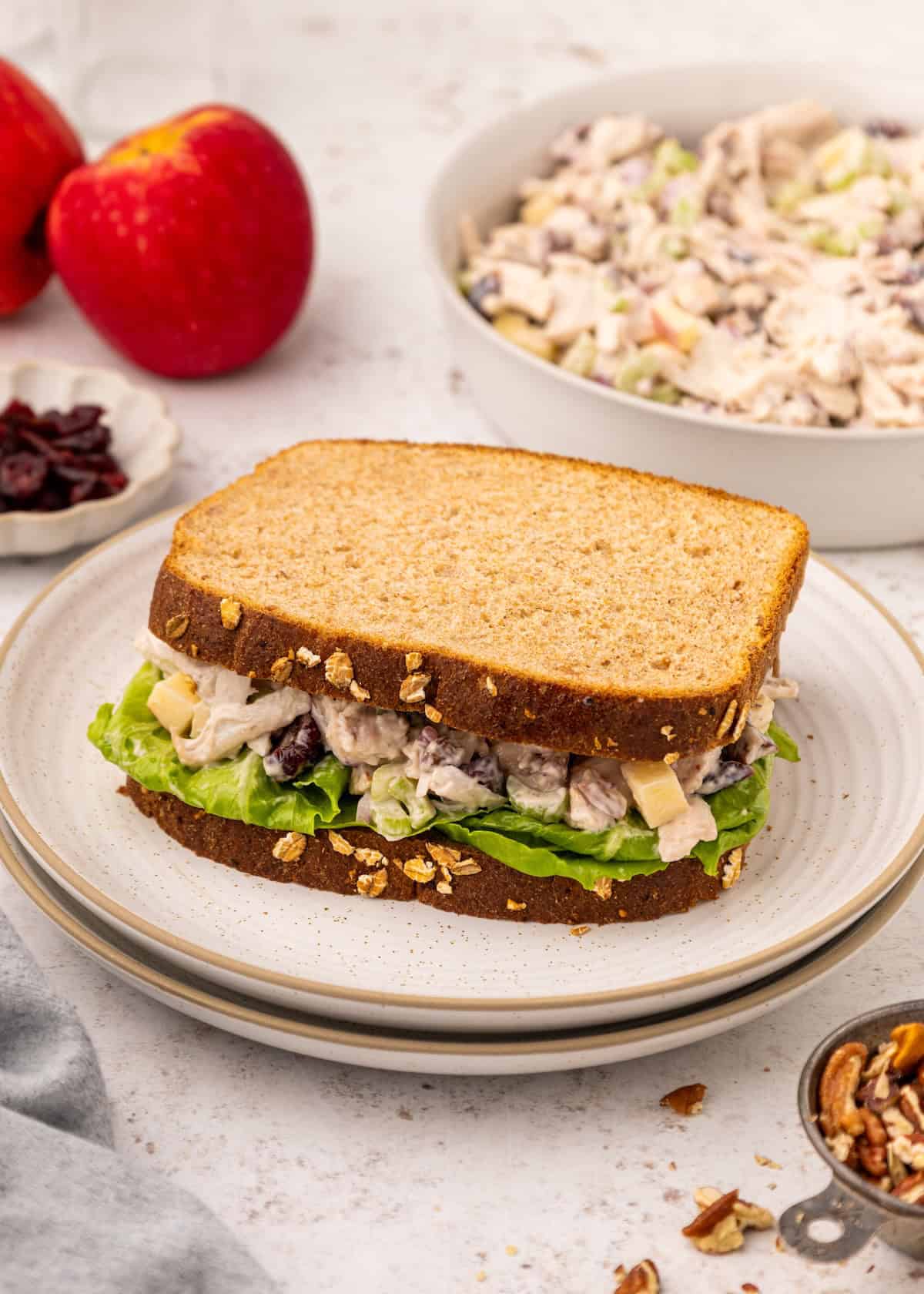 Leftover Turkey Salad on a sandwich, with a bowl of it in the background.